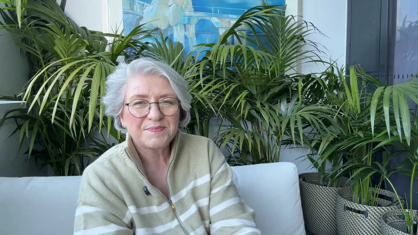 Christine Beard speaking from the indoor plant setting used in the Leadership Collection